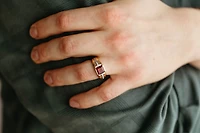 Ring with Garnet and .10 Carat TW of Diamonds in 10kt White and Yellow Gold