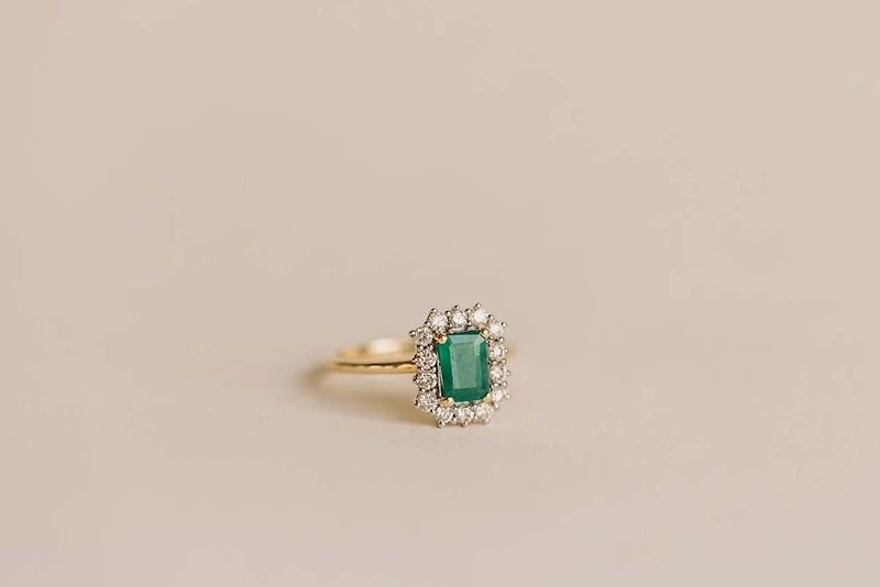 Ring with 7X5MM Emerald Cut Emerald and .45 Carat TW of Diamonds in 14kt Yellow Gold