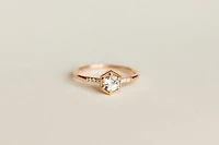 Ring with 5MM Aquamarine and .03 Carat TW of Diamonds in 10kt Rose Gold