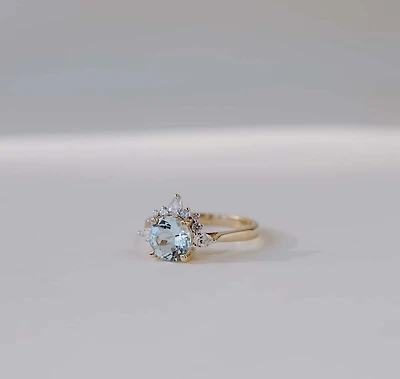 Ring with 7MM Round Aquamarine and .25 Carat TW of Diamonds in 14kt Yellow Gold