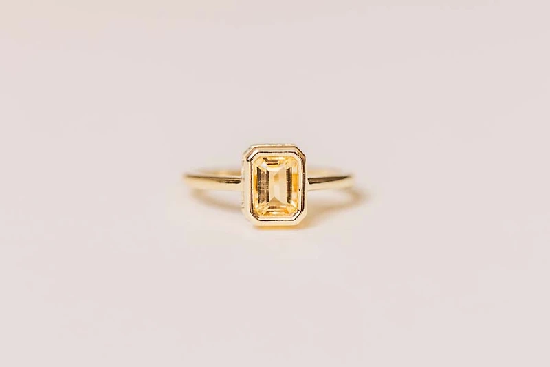Ring with 7x5MM Emerald Cut Citrine in 10kt Yellow Gold
