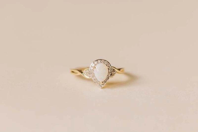 Halo Ring with .17 Carat TW of Diamonds and 7x5MM Pear Shape Opal in 10kt Yellow Gold