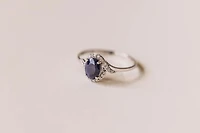 Halo Ring with .10 Carat TW of Diamonds and 7x5MM Oval Blue Sapphire in 10kt White Gold
