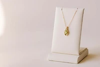 Pendant with 7x5MM Pear Shape Peridot in 10kt Yellow Gold with Chain