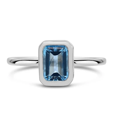 Ring with 7x5MM Emerald Cut Blue Topaz in 10kt White Gold