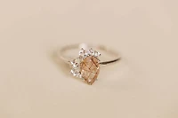 Ring with 9X6MM Pear Shape Rutilated Quartz and White Topaz in 14KT White Gold