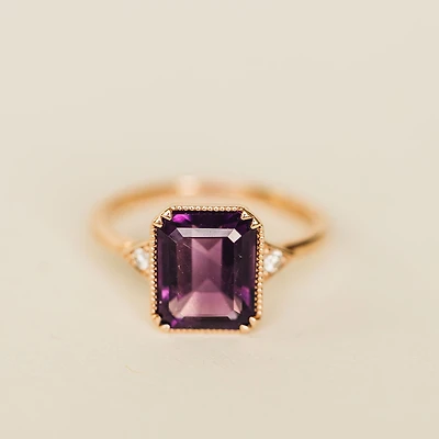 Ring with 10X8MM Emerald Cut Amethyst and .06 Carat TW of Diamonds in 14KT Rose Gold