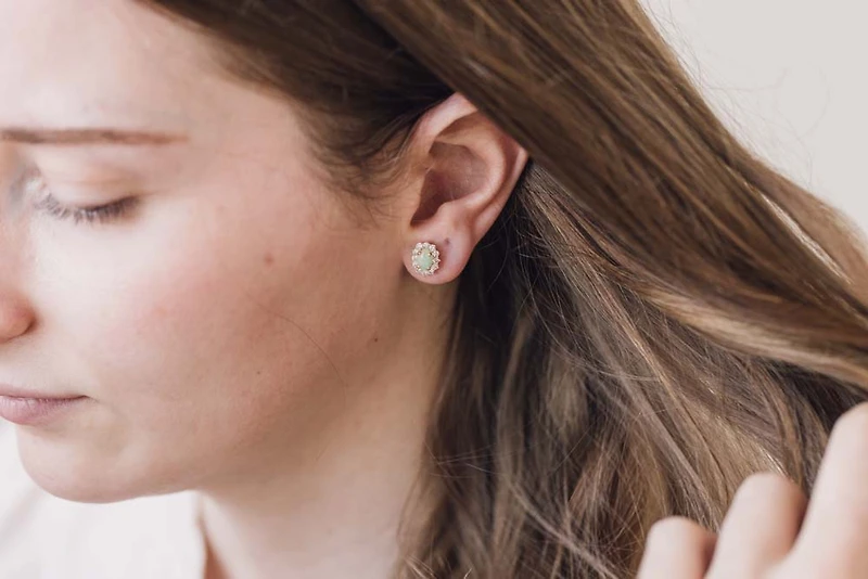 Earrings with .50 Carat TW of Diamonds and 7x5MM Opal in 14kt Yellow Gold