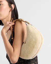 Prada Arqué shearling and leather shoulder bag