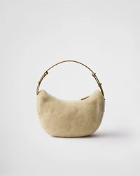 Prada Arqué shearling and leather shoulder bag