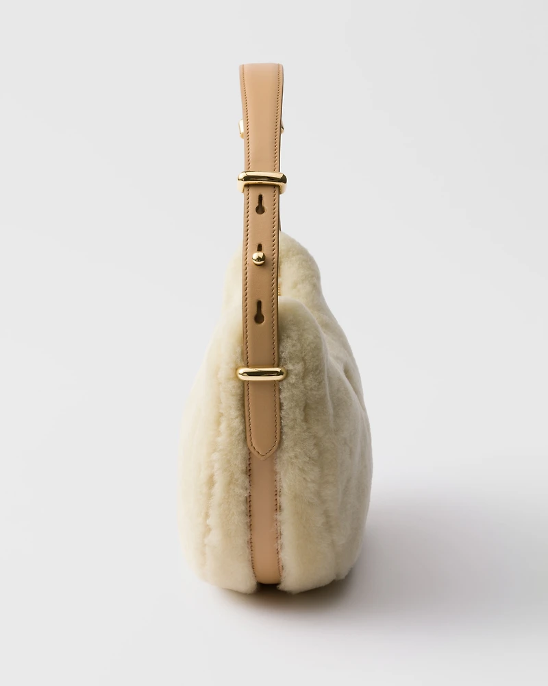 Prada Arqué shearling and leather shoulder bag
