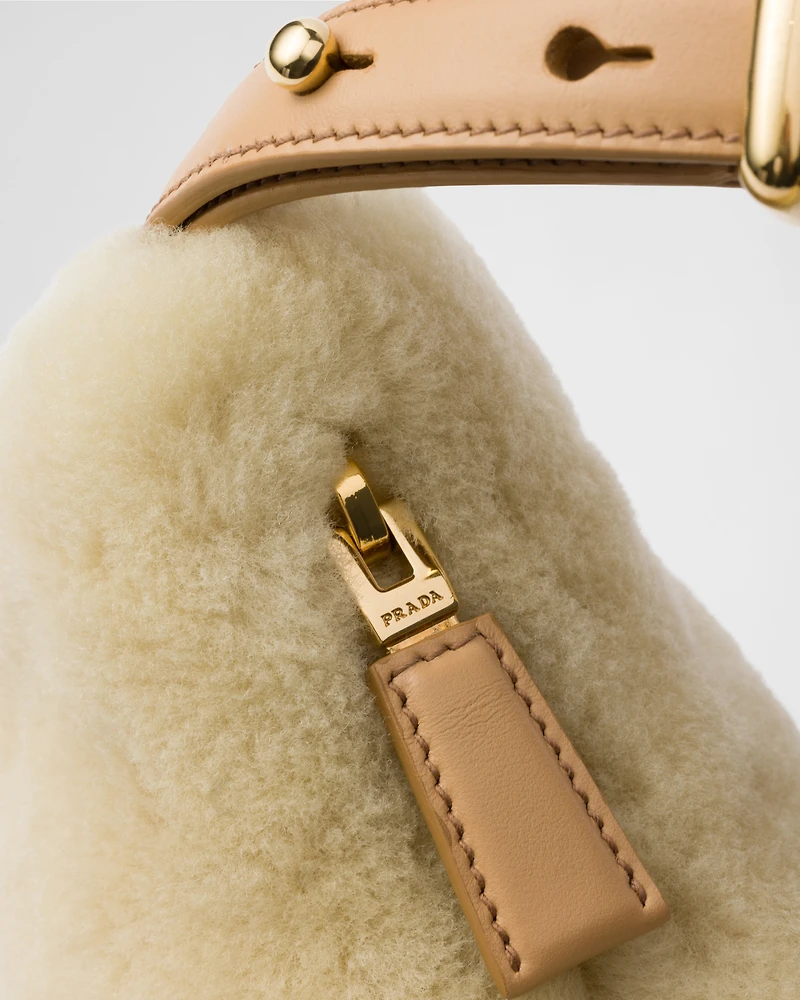 Prada Arqué shearling and leather shoulder bag