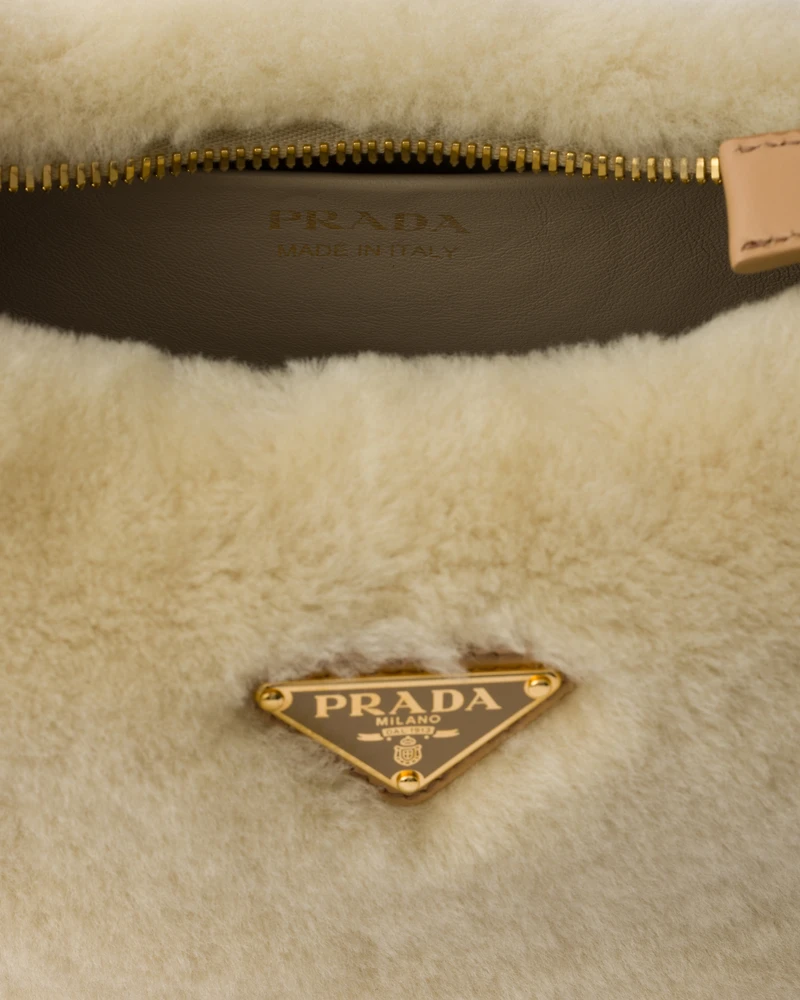Prada Arqué shearling and leather shoulder bag
