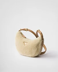 Prada Arqué shearling and leather shoulder bag