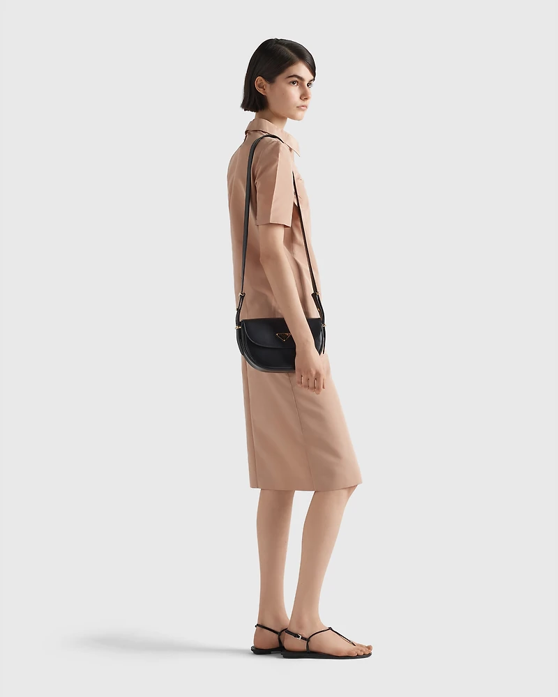 Prada Arqué leather shoulder bag with flap
