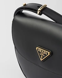 Prada Arqué leather shoulder bag with flap
