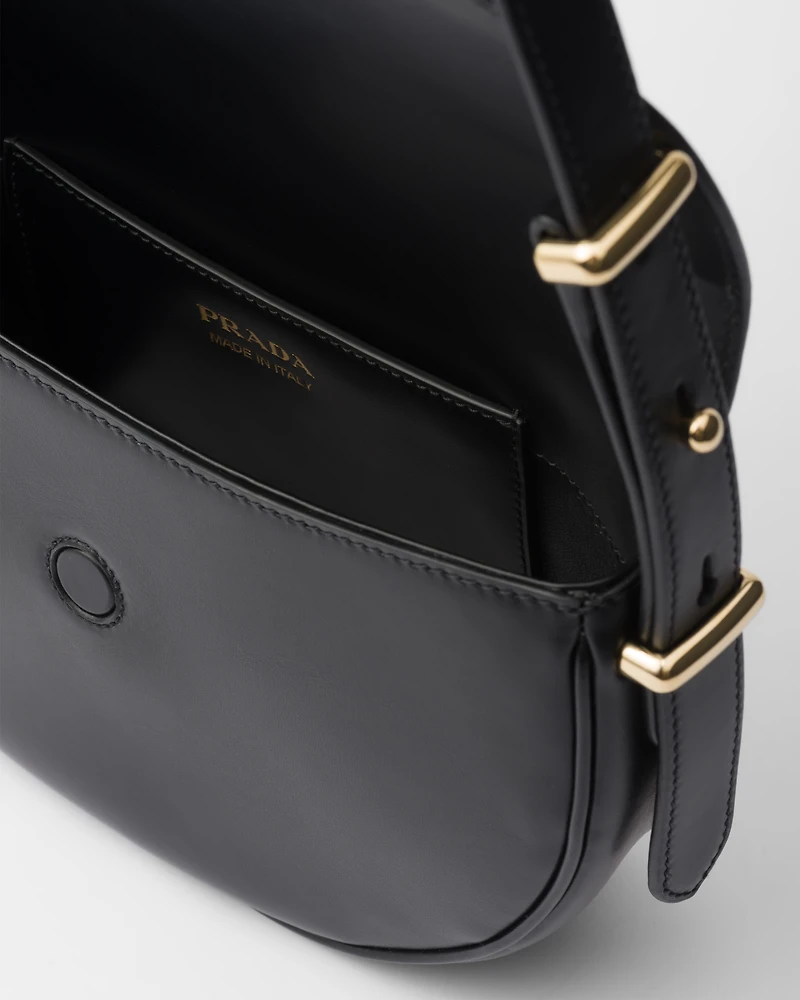 Prada Arqué leather shoulder bag with flap