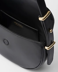 Prada Arqué leather shoulder bag with flap