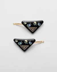 Plexiglas and metal hair barrettes