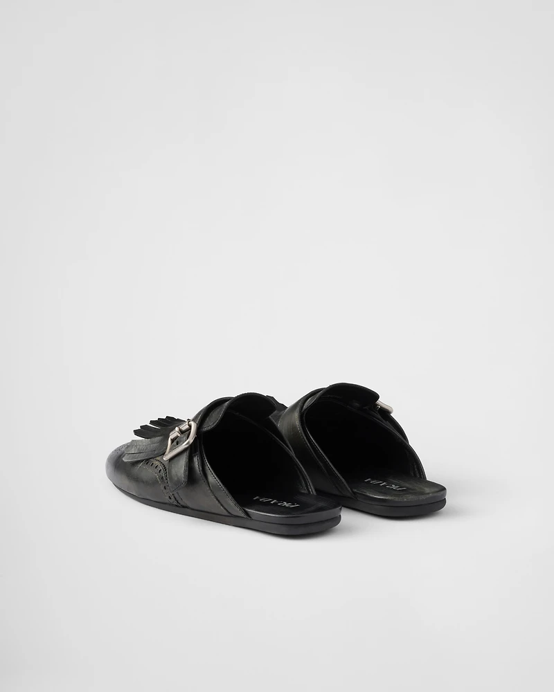 Shuffle fringed leather mules