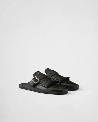 Shuffle fringed leather mules
