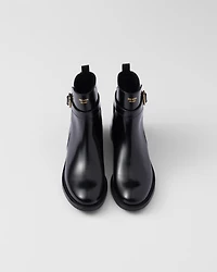 Brushed leather ankle boots with strap