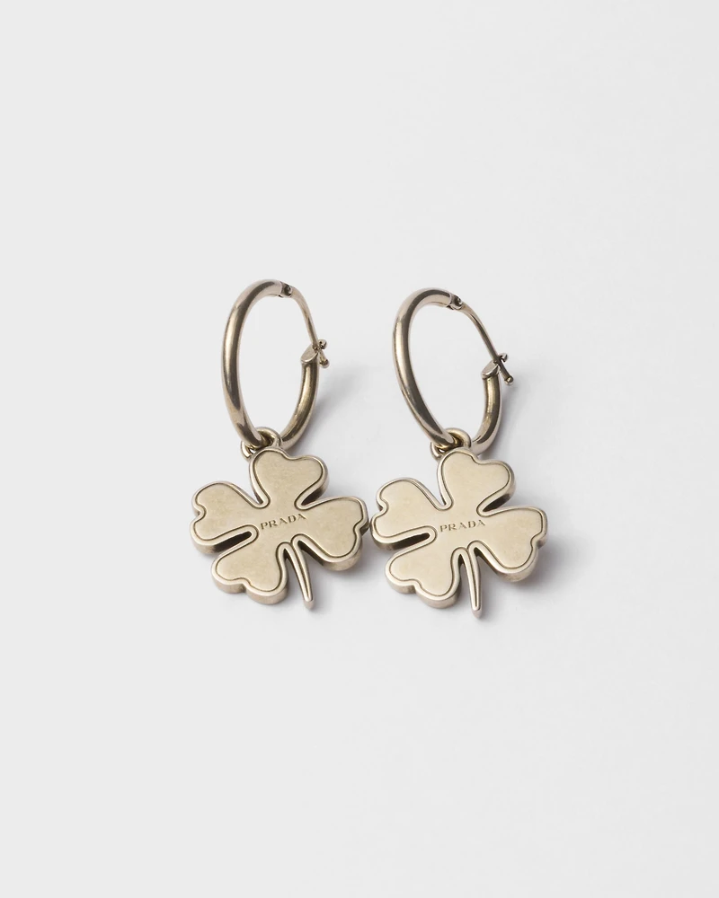 Metal hoop earrings with charm