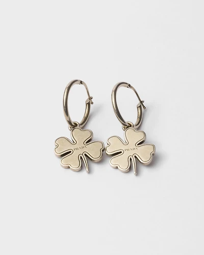 Metal hoop earrings with charm
