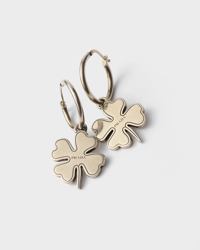 Metal hoop earrings with charm