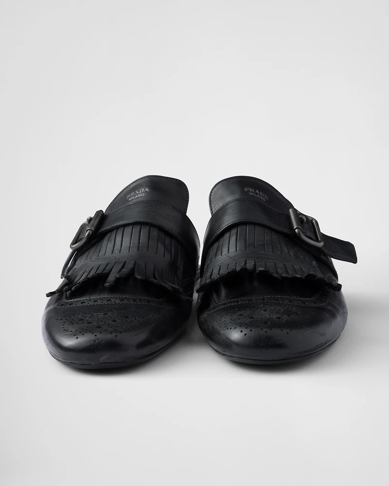 Shuffle fringed monk strap leather mules