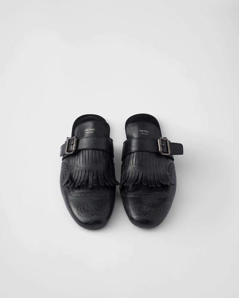 Shuffle fringed monk strap leather mules