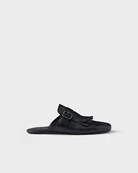 Shuffle antiqued leather mules with buckled strap and fringe