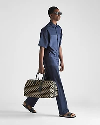Large Prada Symbole embroidered fabric travel bag