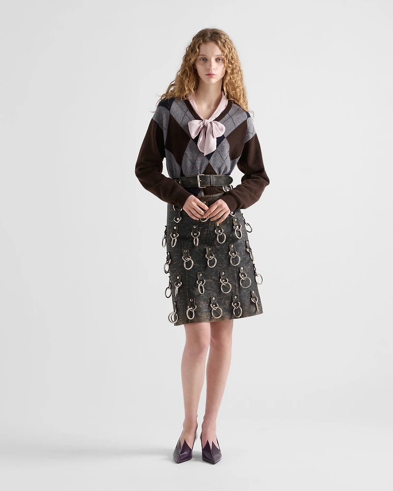 Leather miniskirt with metal rings