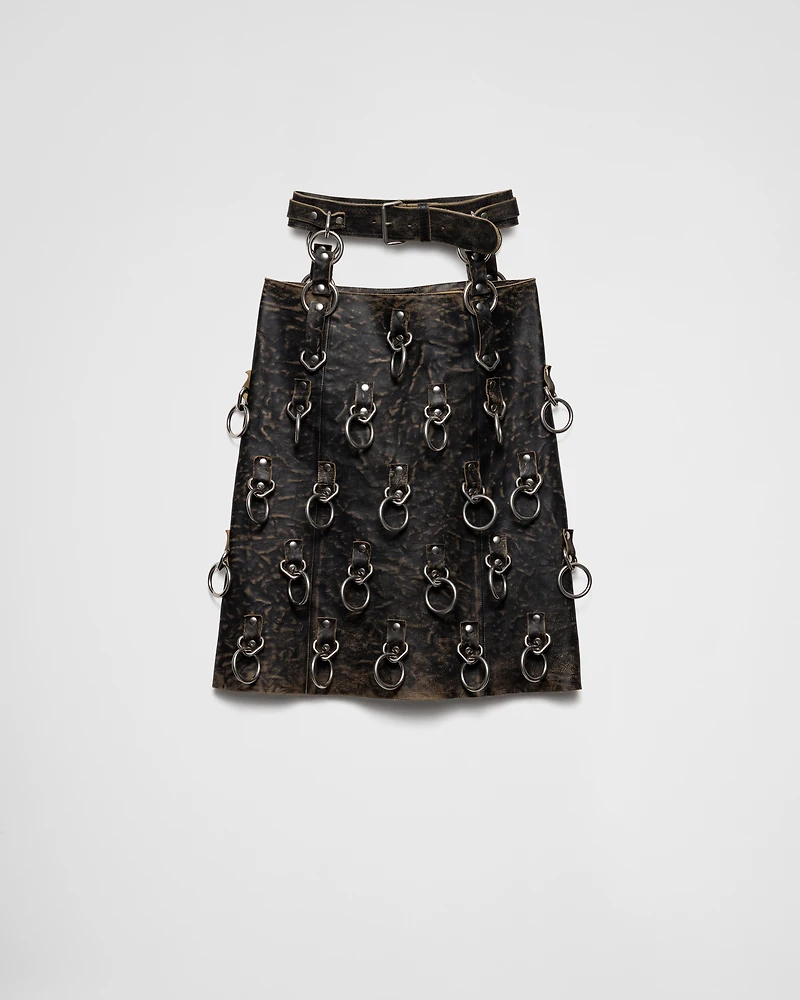 Leather miniskirt with metal rings