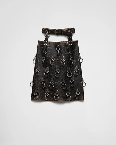 Leather miniskirt with metal rings