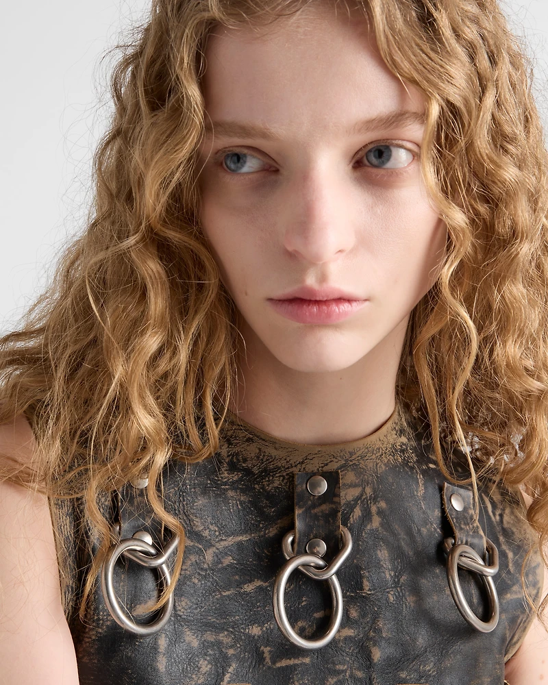 Leather dress with metal appliqués
