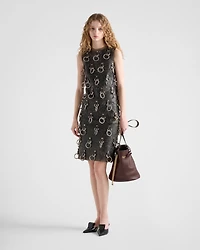 Leather dress with metal appliqués