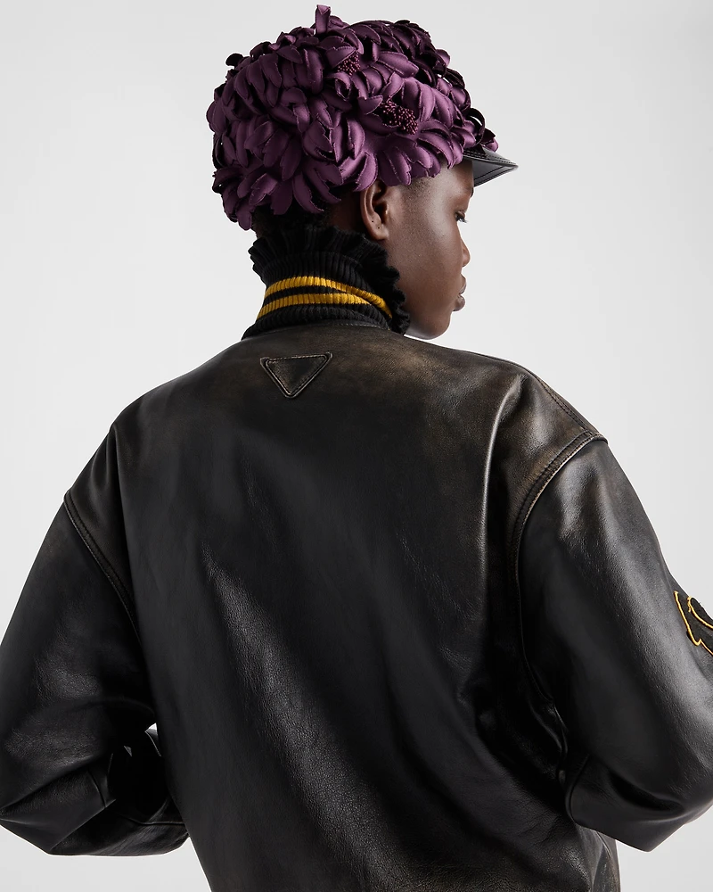 Leather bomber jacket with patch