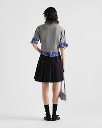 Pleated gabardine miniskirt with metal rings