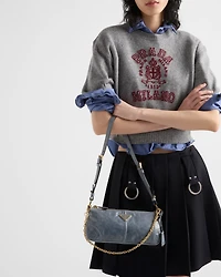 Pleated gabardine miniskirt with metal rings