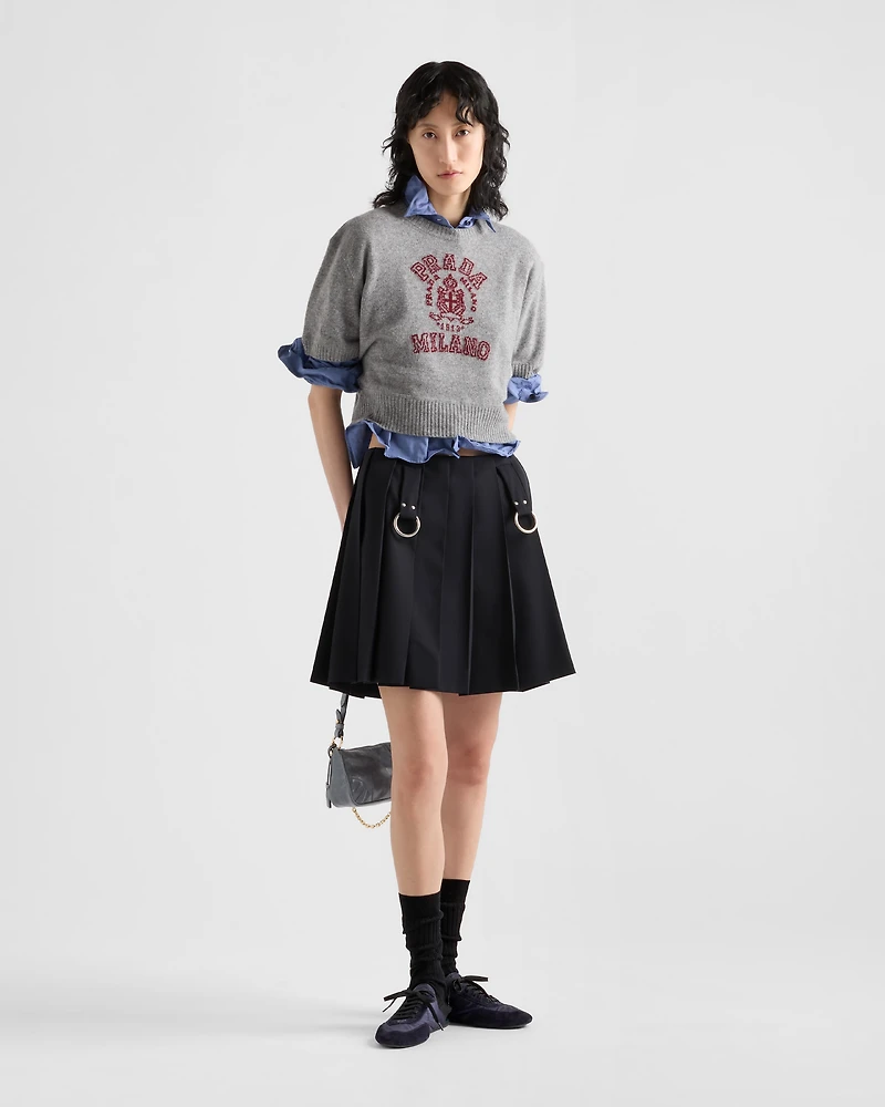 Pleated gabardine miniskirt with metal rings