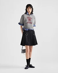 Pleated gabardine miniskirt with metal rings