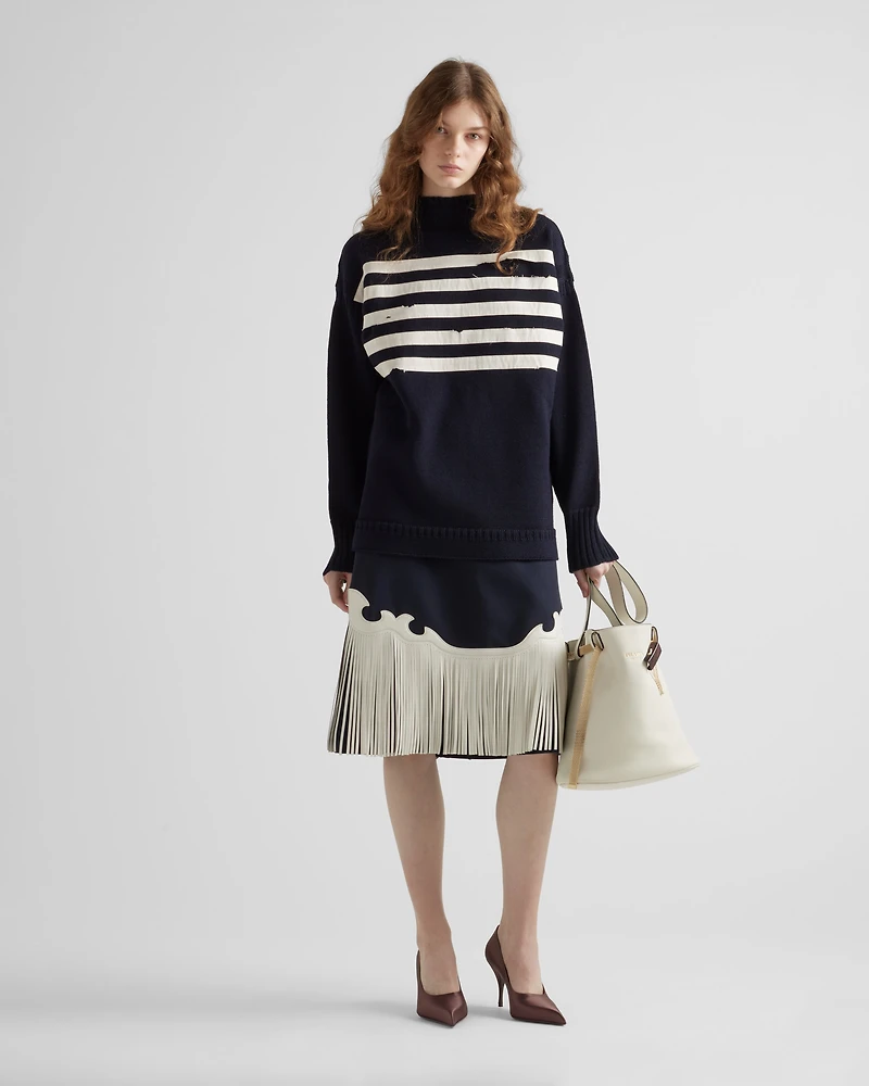 Rush stitch skirt with leather fringe