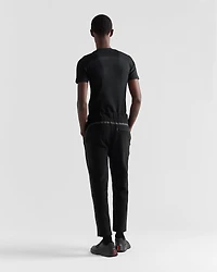 Technical fabric pants with heat-sealed tape