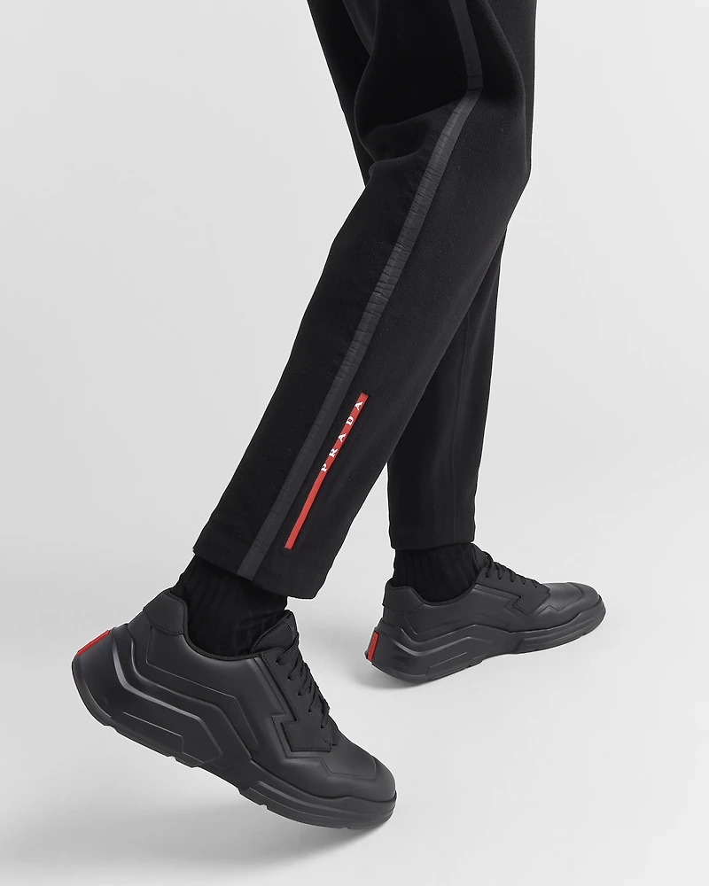 Technical fabric pants with heat-sealed tape