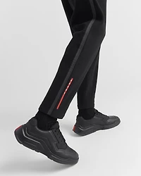 Technical fabric pants with heat-sealed tape