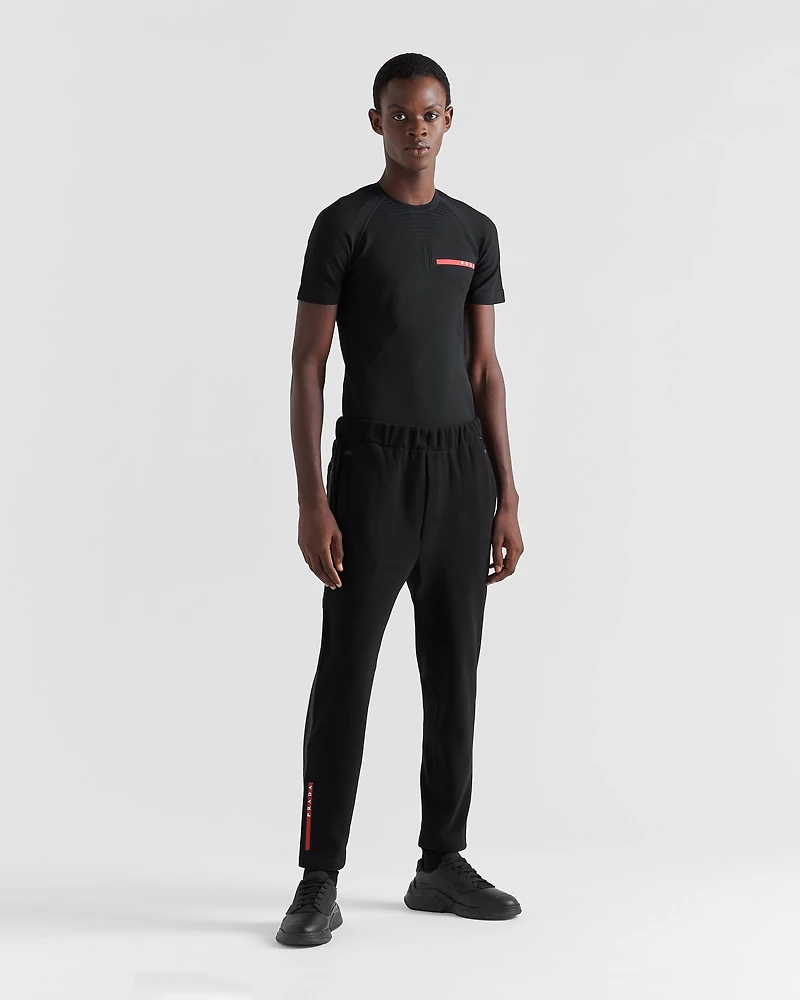 Technical fabric pants with heat-sealed tape
