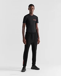Technical fabric pants with heat-sealed tape