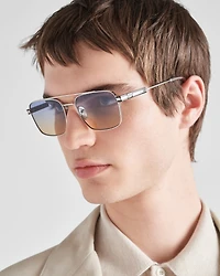 Sunglasses with iconic metal plaque